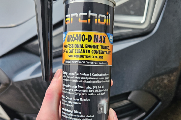 Archoil AR6400-D Max being held at the front of a vehicle