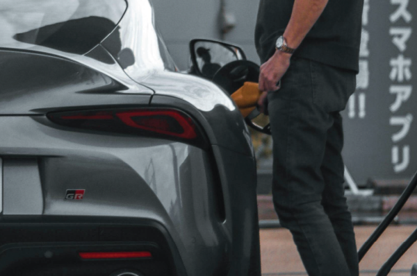 Someone filling a car with fuel